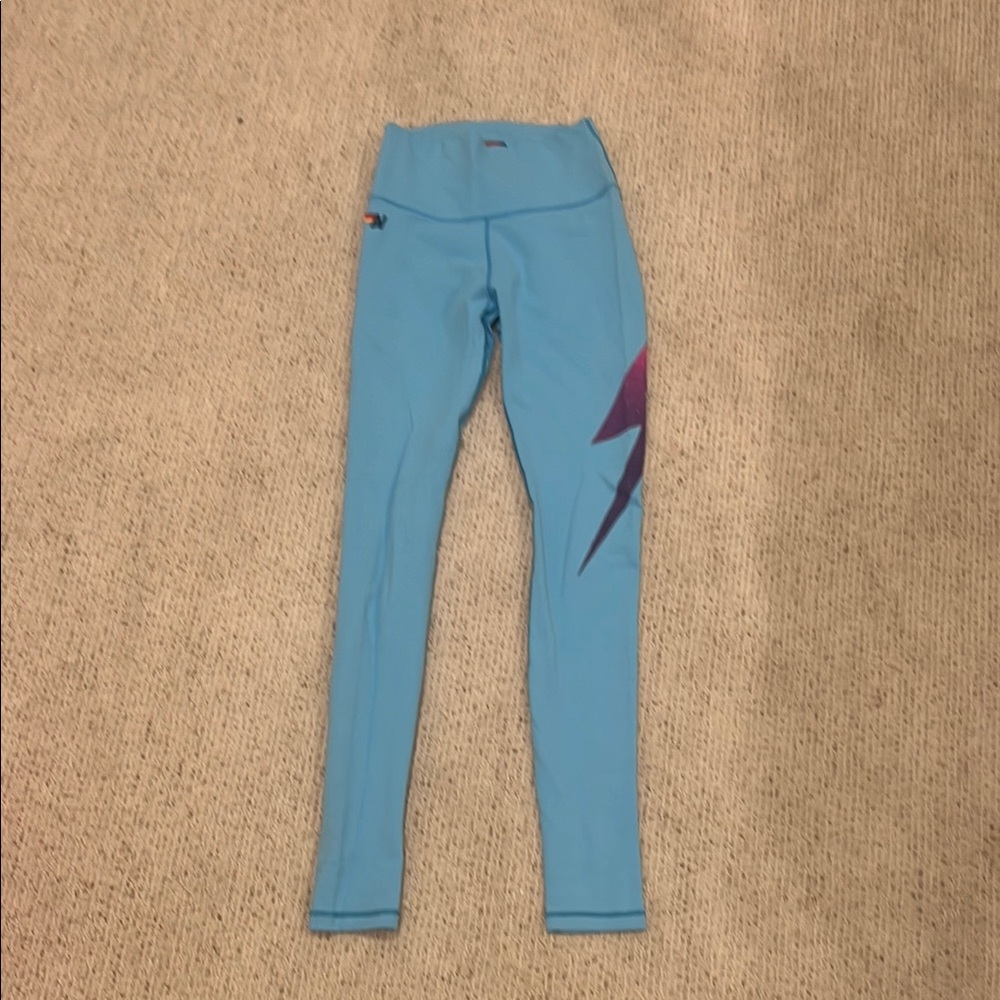 AVIATOR NATION BLUE LEGGINGS WITH PINK AND PURPLE LIGHTNING BOLT
